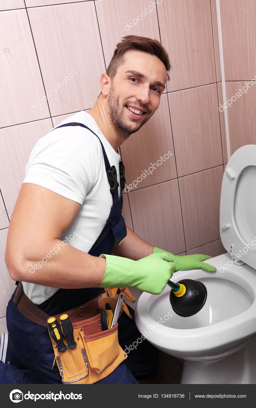 Plumber Repairing Toilet Stock Photo Belchonock 134816736