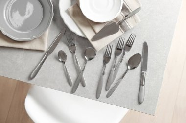 Cutlery set with plates clipart