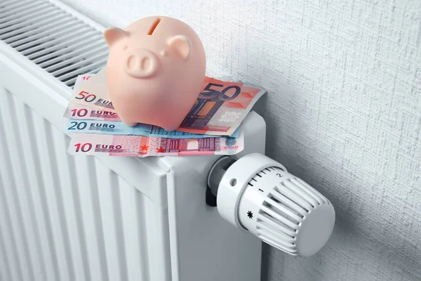 Heating battery with piggy bank — Stock Photo, Image