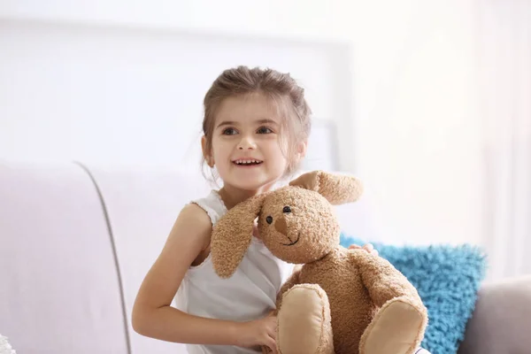 Funny little girl with toy — Stock Photo, Image