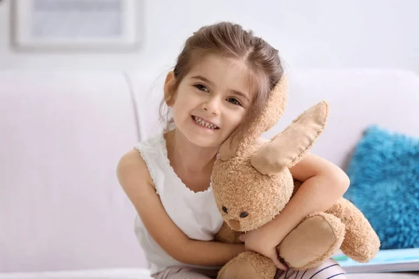 Funny little girl with toy — Stock Photo, Image