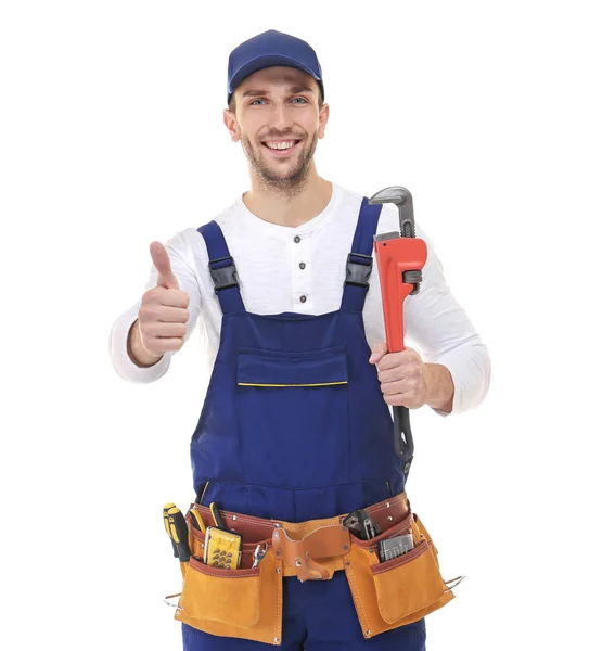 Smiling plumber holding screw-wrench — Stock Photo, Image