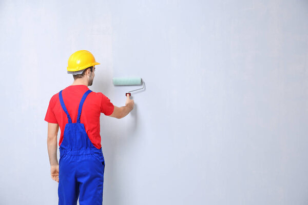worker painting wall 