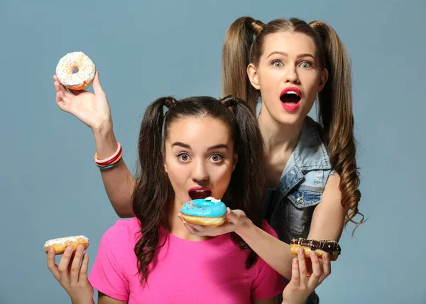 Women with tasty donuts — 스톡 사진