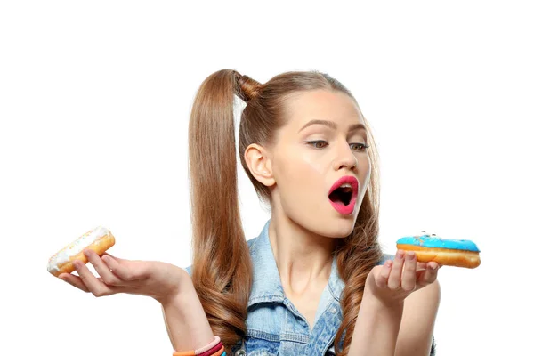 Funny young woman with tasty donuts on white background — Stock Photo, Image