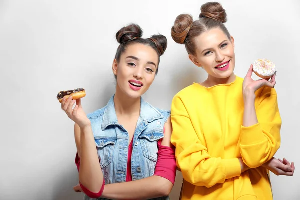 Women with tasty donuts — 스톡 사진