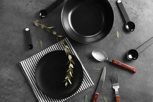 Black plates and cutlery — Stock Photo, Image