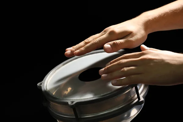 Man playing African drum Stock Photo