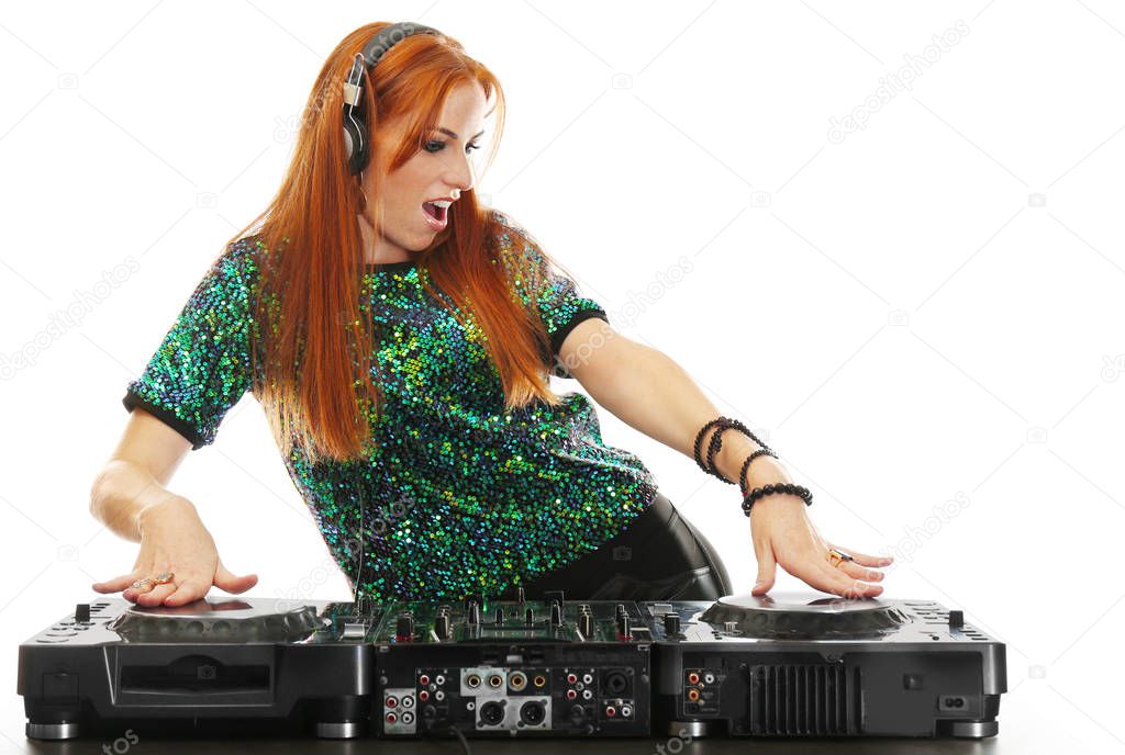 Beautiful female dj mixing music on white background