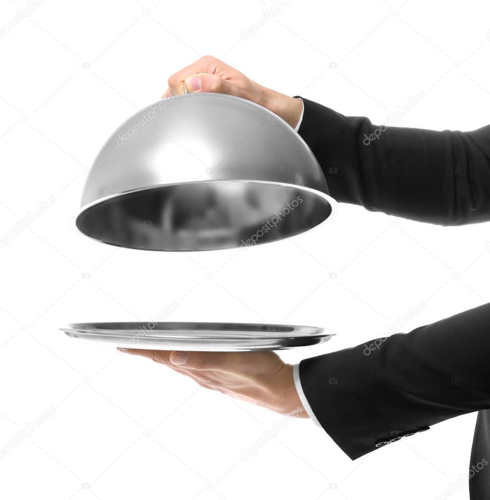 Hands of waiter holding tray