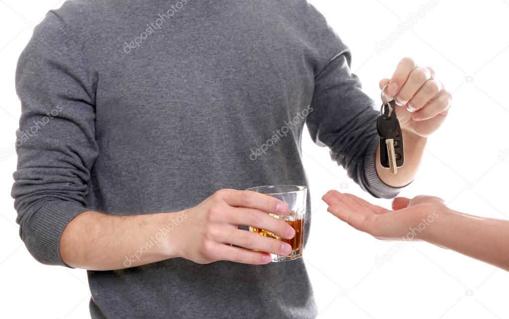 drunk man giving car key 