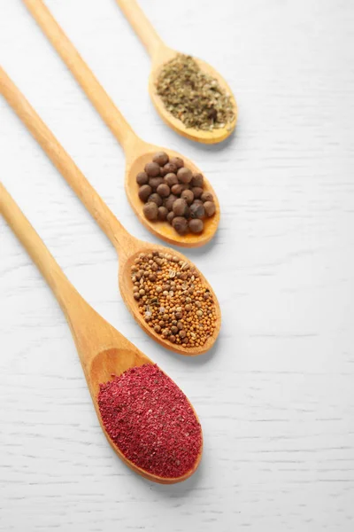 Different spices in spoons — Stock Photo, Image