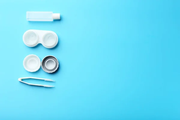 Contact lenses, tweezers and bottle of solution — Stock Photo, Image