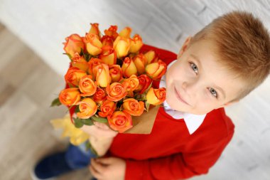 boy with bouquet of beautiful flowers clipart