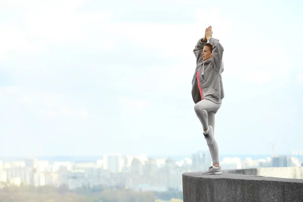 Young woman doing yoga exercises — Stock Photo, Image