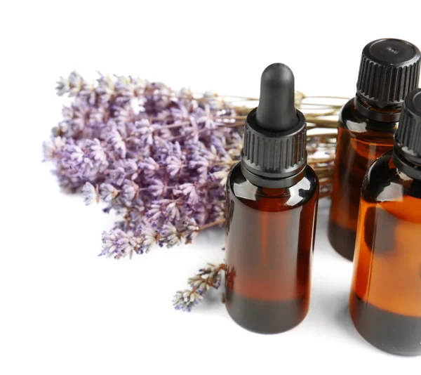 Bottles with essential oil and lavender — Stock Photo, Image