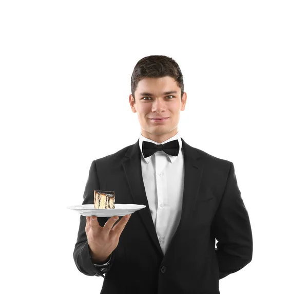 Waiter holding plate with cake — Stock Photo, Image