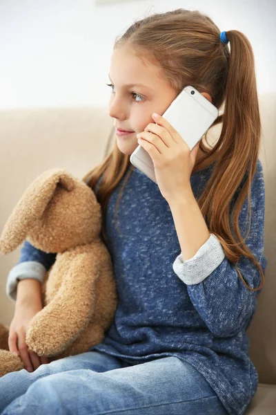 Cute girl talking by phone