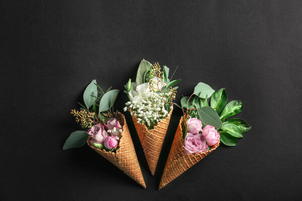 Composition of waffle cones with flowers