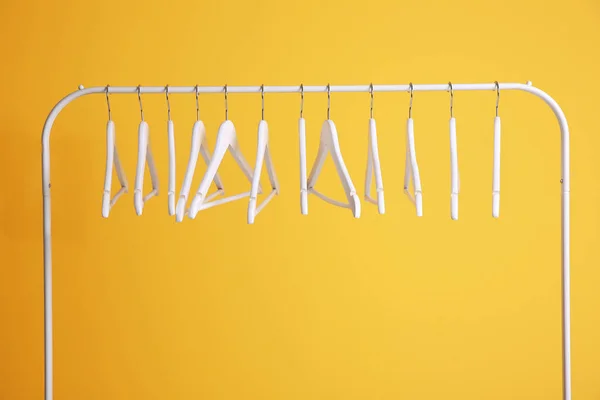 Modern hangers on yellow wall — Stock Photo, Image