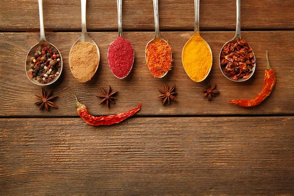 Different spices in spoons — Stock Photo, Image