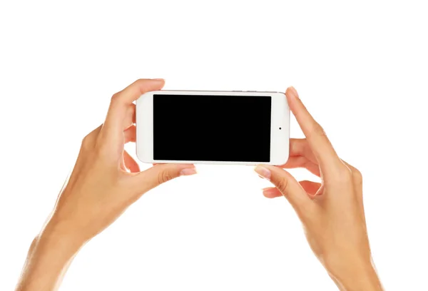 Hands holding cellphone — Stock Photo, Image