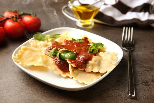 Plate of ravioli with tomato sauce — Stock Photo, Image