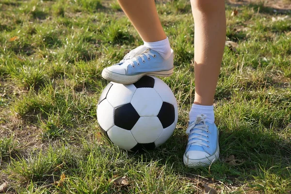 Boy legs with football ball — Stock Photo, Image