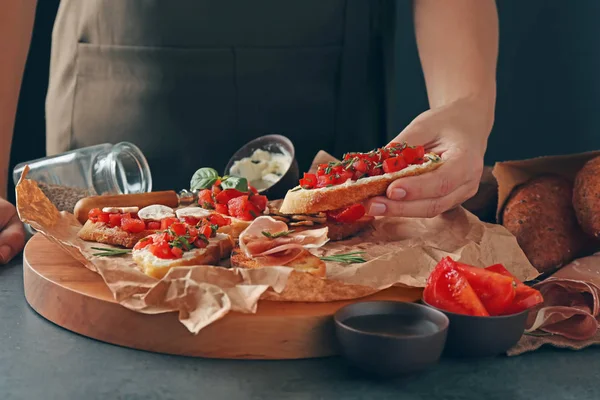 stock image Woman holding tasty bruschetta 