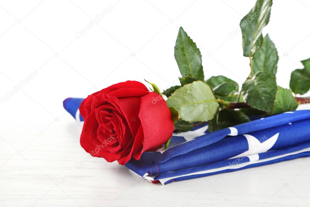 Red rose on American flag