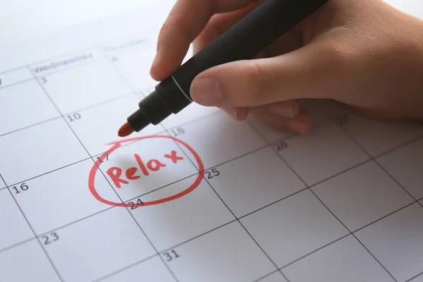 Female hand writing word "relax" — Stock Photo, Image