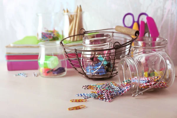 Paperclips and tools in jars — Stock Photo, Image