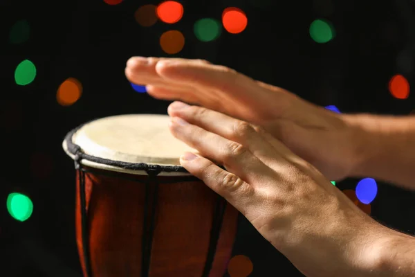 Man playing African drum — Stock Photo, Image