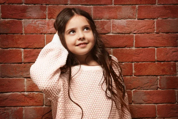 Cute little girl in warm sweater — Stock Photo, Image