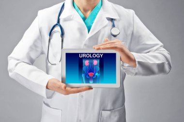 Doctor with tablet in hands.  clipart