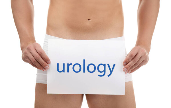 Man holding paper with word UROLOGY