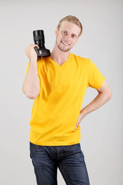 Handsome photographer with camera — Stock Photo, Image