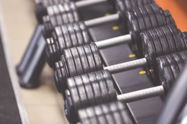Rack with dumbbells in gym — Stock Photo, Image