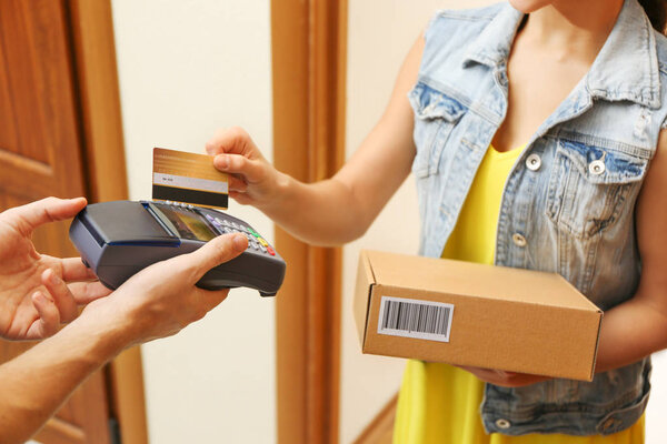 woman paying for parcel 