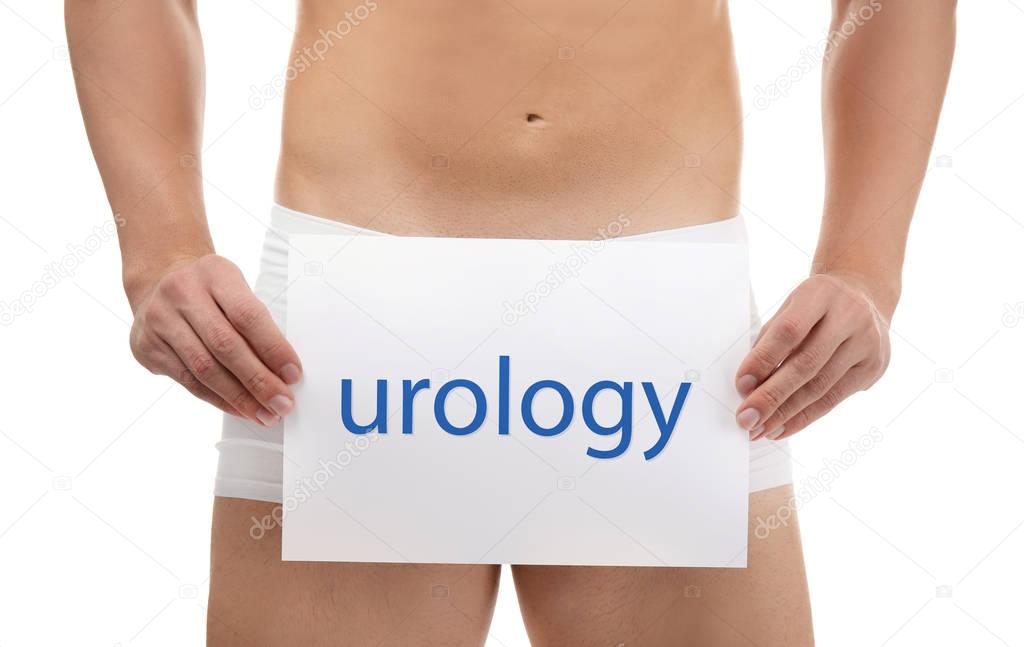 Man holding paper with word UROLOGY