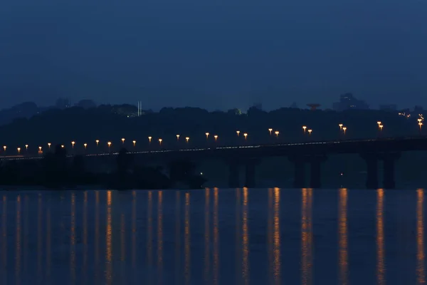 Bridge with lights over river — Stock Photo, Image