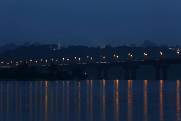 Bridge with lights over river