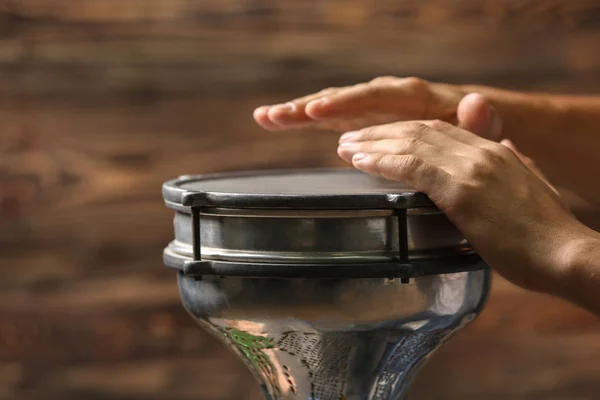 Hands of man playing African drum — Stock Photo, Image