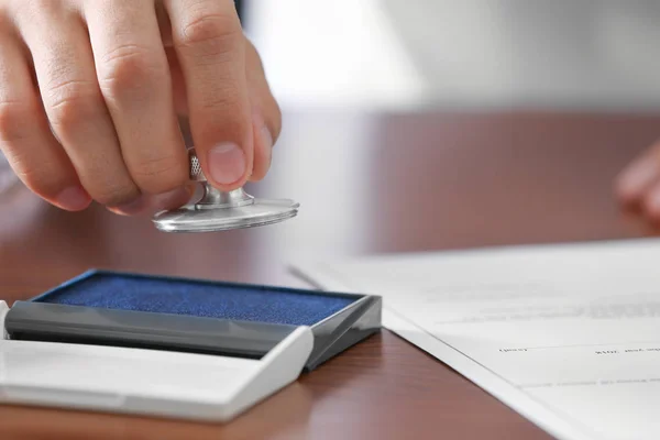 Notary public pressing stamp — Stock Photo, Image