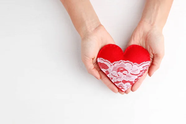 Female hands holding  heart — Stock Photo, Image