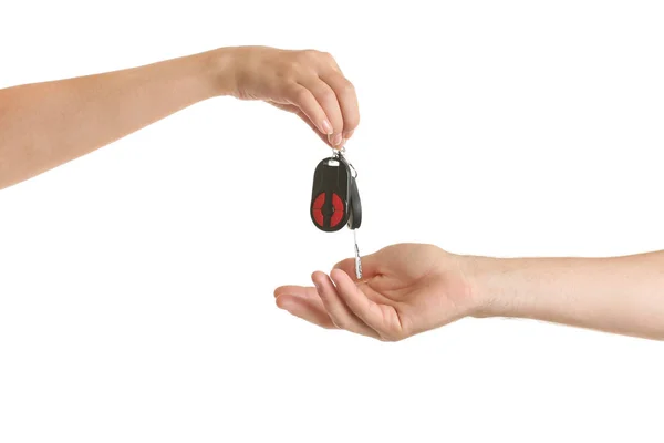 Female hand giving car key — Stock Photo, Image