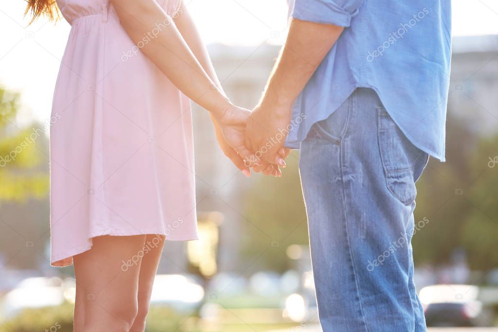 couple holding hands together