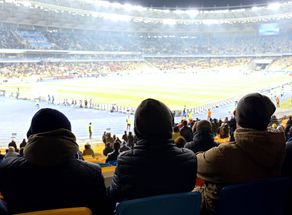 Fans watching football game