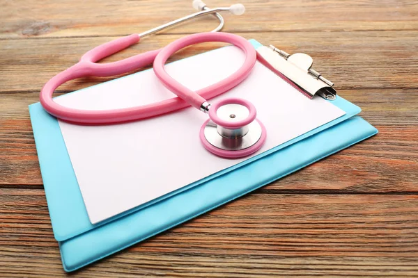 Pink stethoscope and folder — Stock Photo, Image