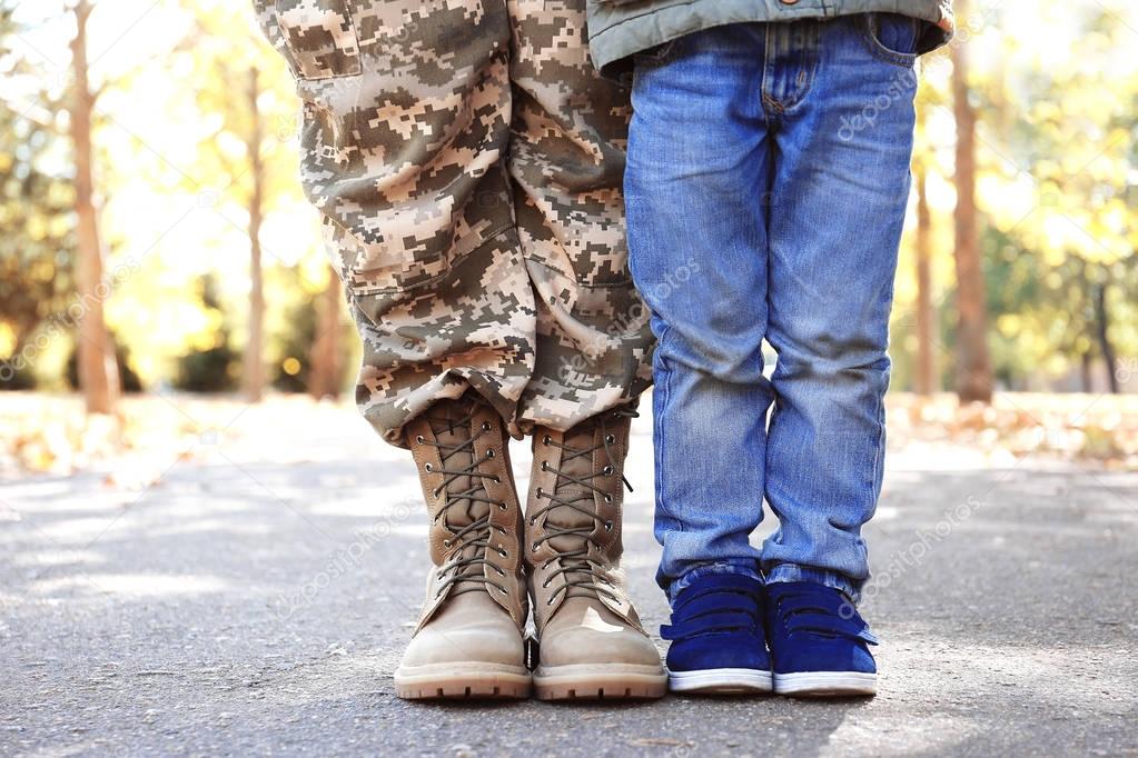 Mother soldier and little kid 